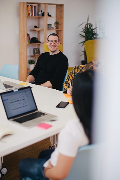 two agency workers talking to one another