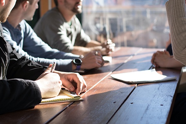 people at a conference room table